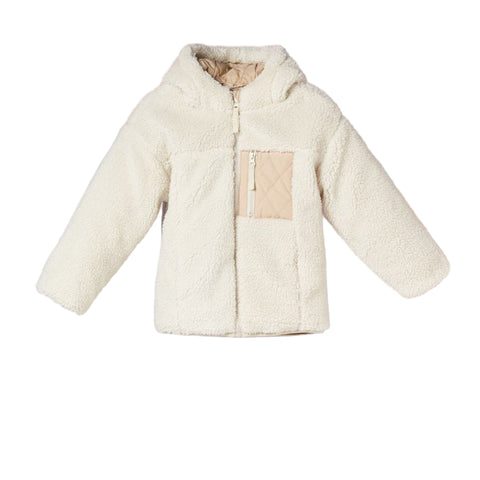 Beige quilted jacket on a mannequin against a soft focus background
