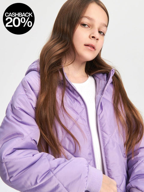 Person wearing a purple jacket on a plain background