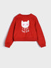 Red sweatshirt with a cat graphic and 'Love is in the Air' text on a light gray background