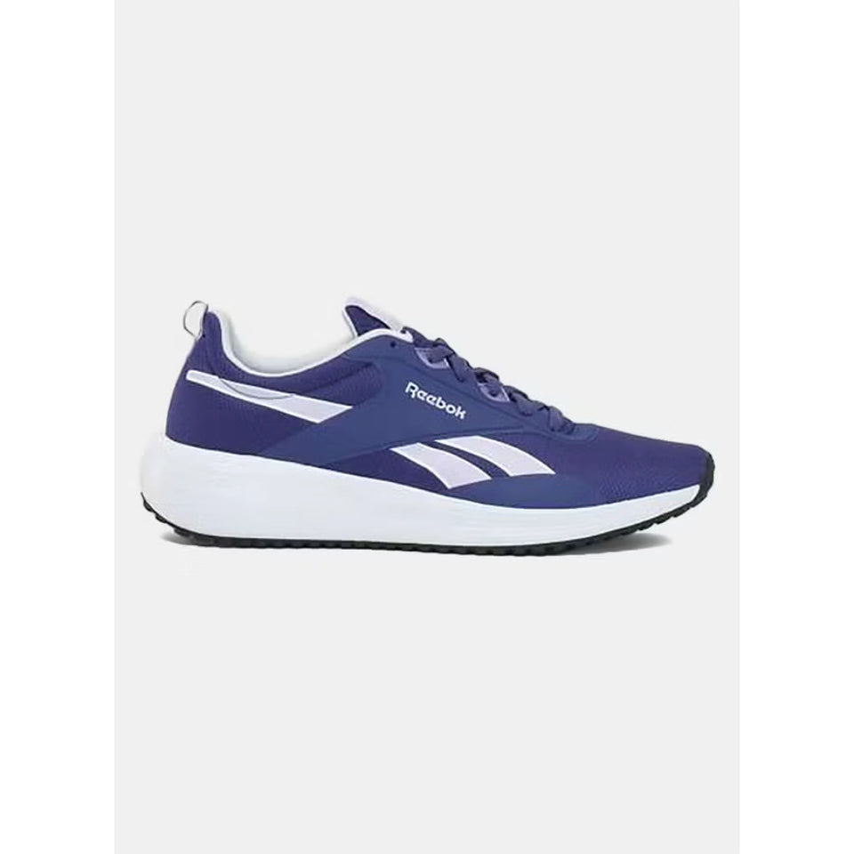 A Reebok athletic sneaker in a deep periwinkle blue color with white accents, including the brand name, the iconic side stripe, and the midsole, shown against a light gray background.
