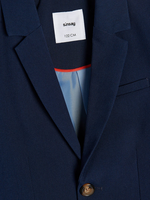 Navy blue blazer with a visible brand label on the chest pocket.