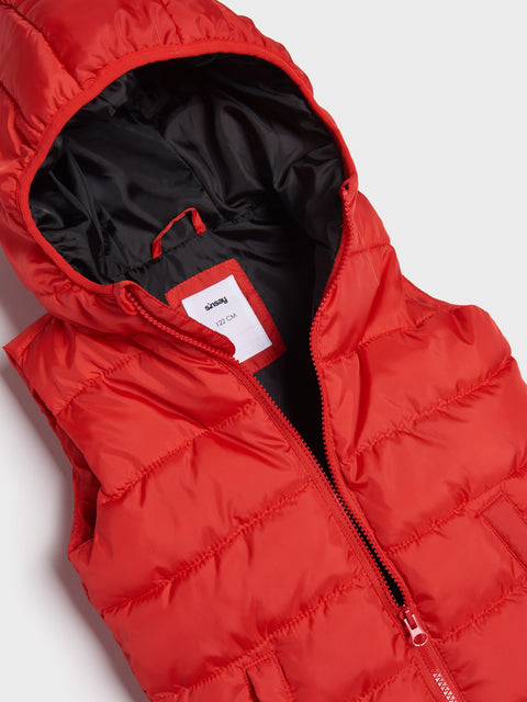 Red puffer vest with a brand label on a light gray background