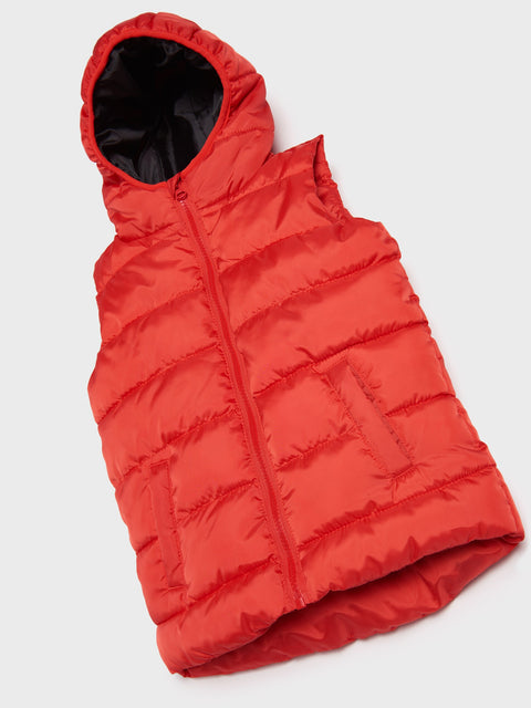 Red puffer vest on a white background