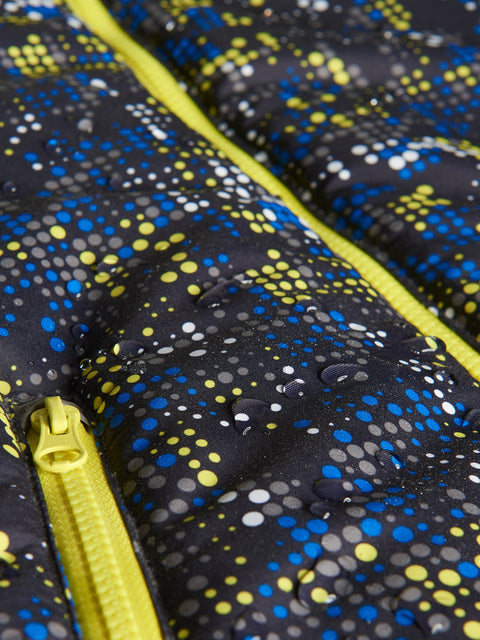 Close-up of a patterned jacket with yellow zipper
