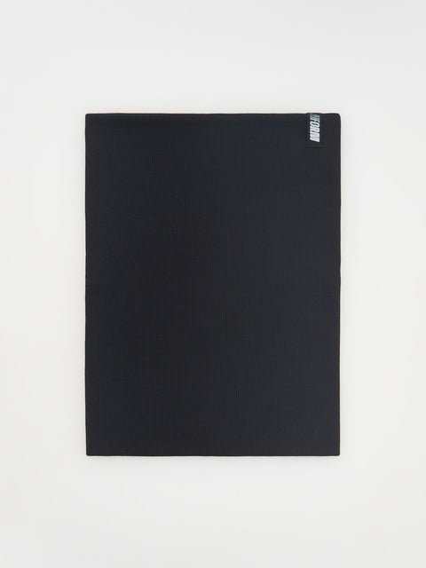 Black yoga mat with a brand logo on a white background