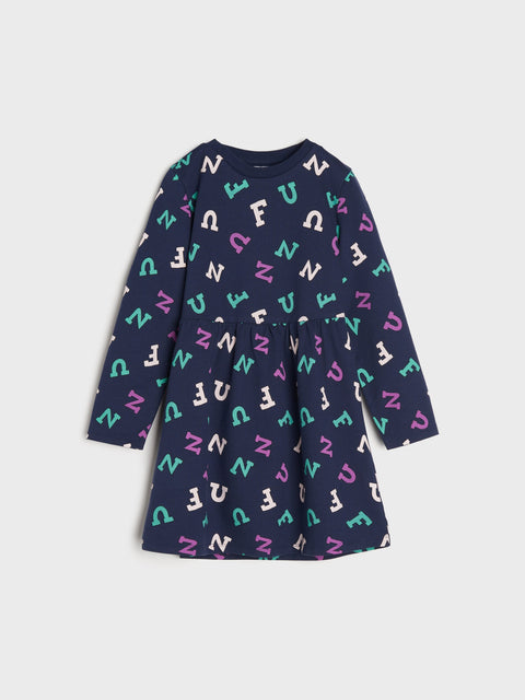 Navy dress with colorful letter pattern on a light gray background
