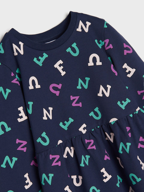 Navy blue dress with colorful letter pattern on a light gray background