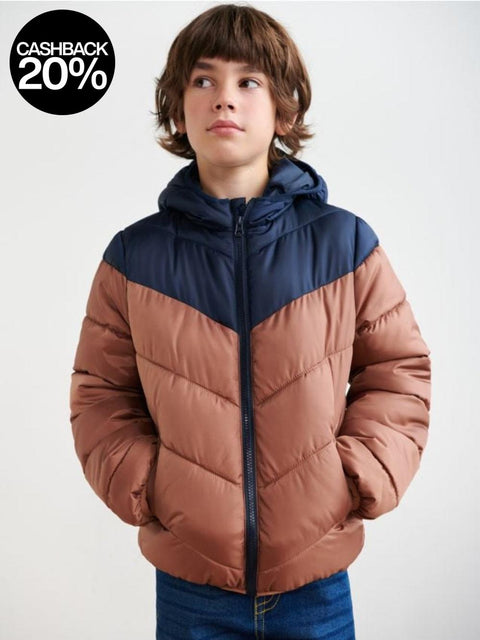 Child wearing a two-tone puffer jacket with brown and navy colors on a white background