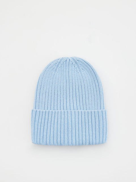 Light blue knit beanie on a light gray background