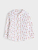 White shirt with colorful pattern on a light gray background