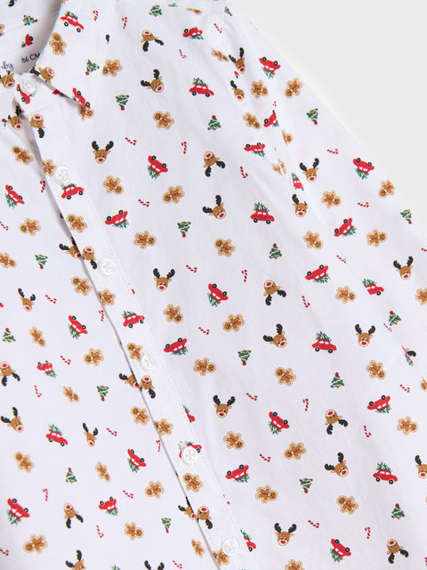 Floral patterned fabric with small red cars and deer heads on a white background