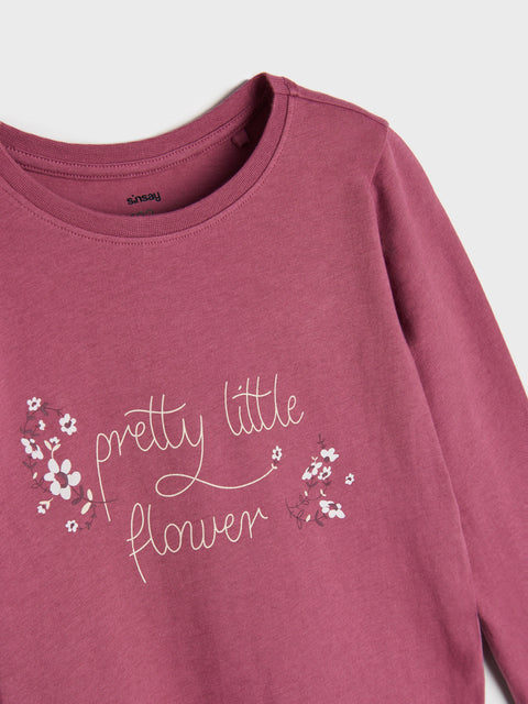 Mauve sweatshirt with 'pretty little flower' text and floral designs on a white background