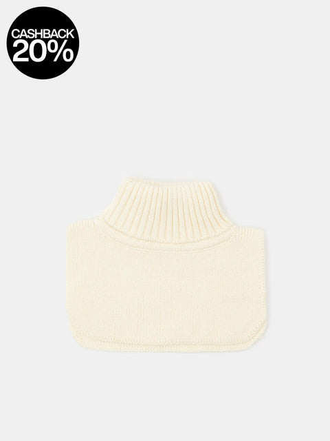 Cream-colored knitted turtleneck sweater on a light gray background