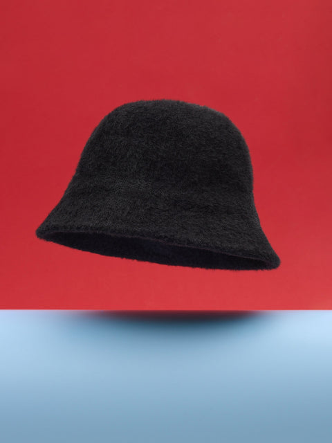 Black bucket hat on a red and blue gradient background