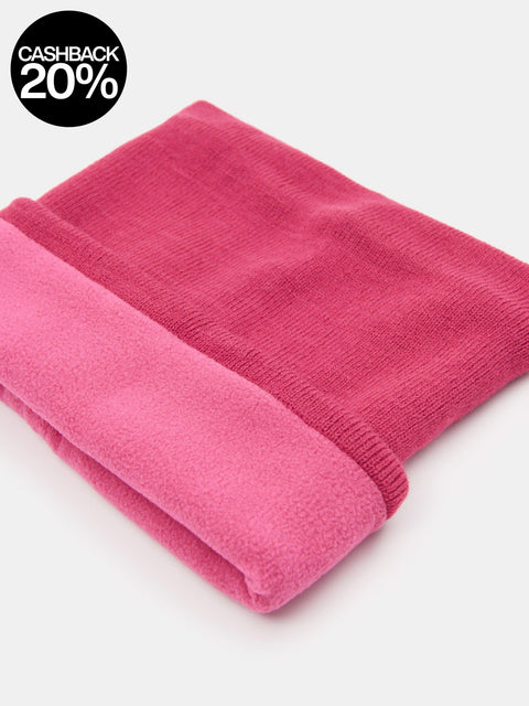 Folded pink blanket on a white background