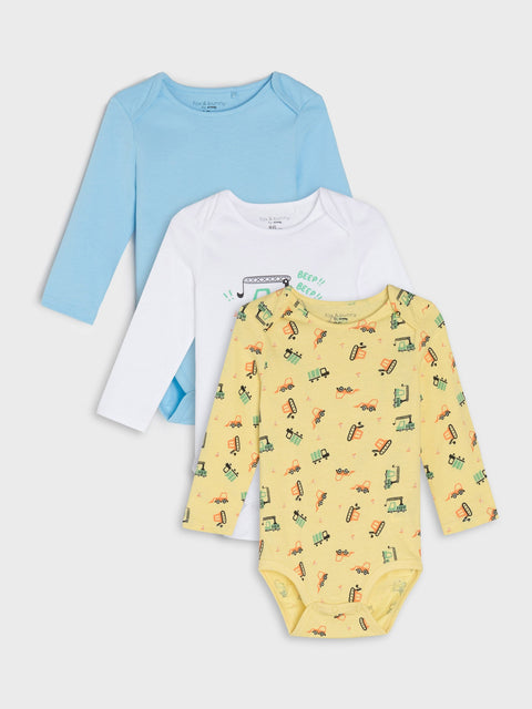 Three baby bodysuits in blue, white, and yellow with car pattern on a light gray background