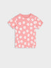 Pink t-shirt with white floral pattern on a light gray background