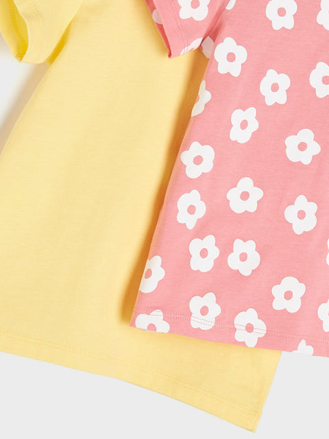 Yellow and pink fabric with white floral patterns on a white background