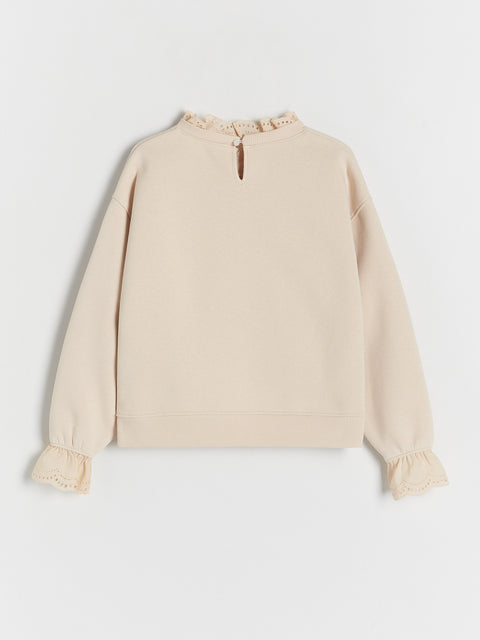 Beige blouse with long sleeves on a white background
