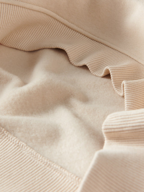 Close-up of beige fabric with ruffled texture