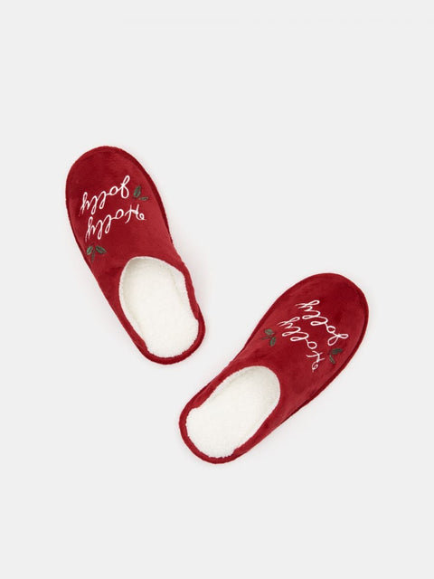 Red slippers with white soles on a light gray background