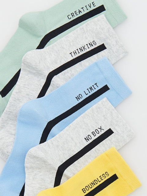 Set of colorful socks with motivational text on a light background