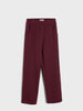 Maroon pants on a light gray background