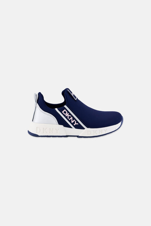 Navy and white slip-on sneaker with DKNY logo on a light gray background