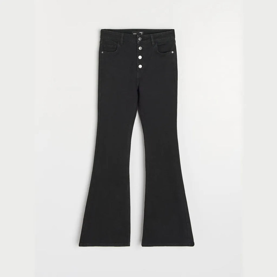 Black flare jeans with a five-button fly, displayed flat against a light gray background.
