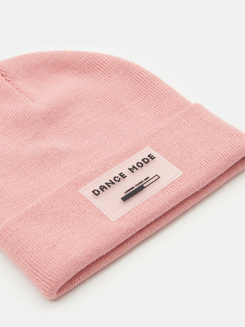 Pink beanie with 'DANCE MODE' label on a white background