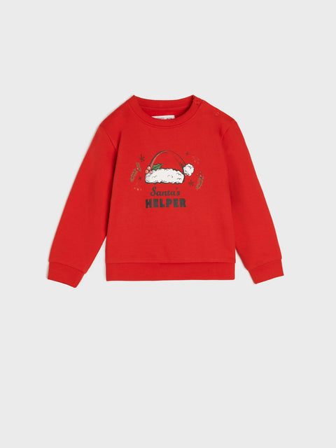 Red children's sweatshirt with a graphic design on a white background