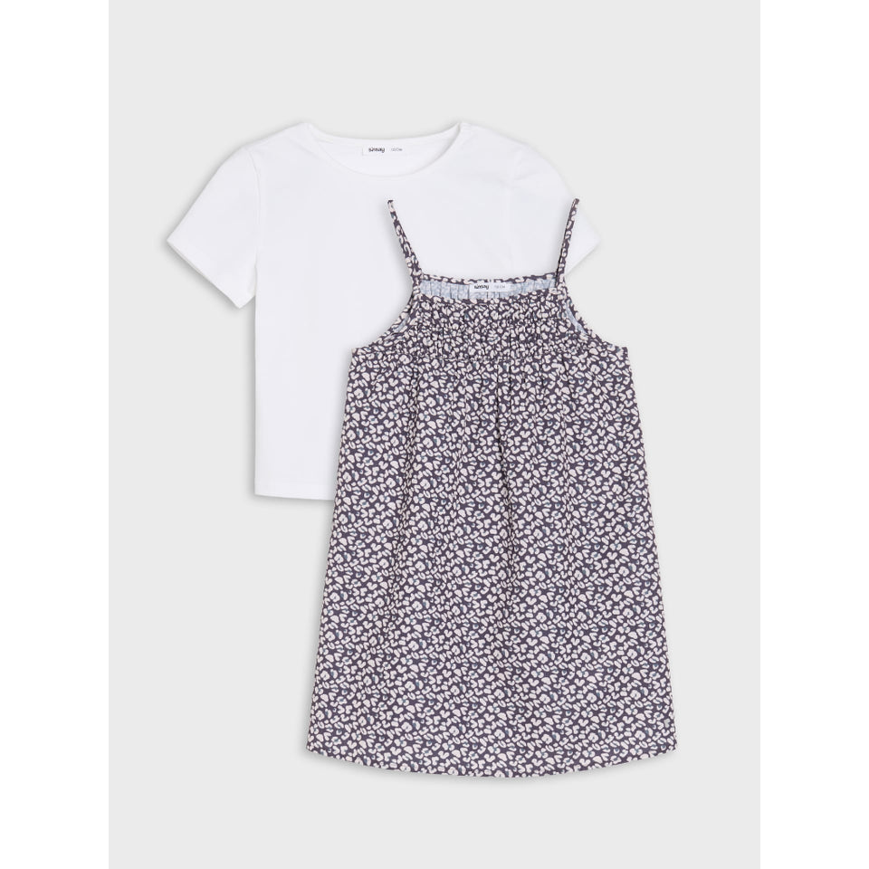 A two-piece children's outfit set featuring a white short-sleeve crewneck t-shirt and a matching white sleeveless slip dress with a dense small floral print in purple and green, displayed on a light gray background.