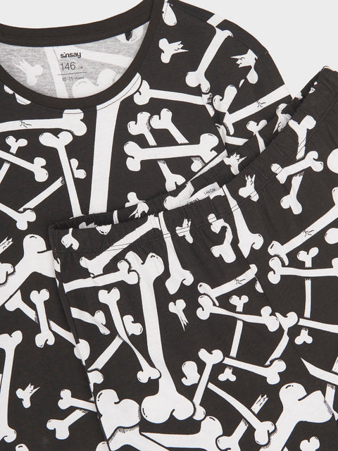 Black t-shirt with white skeleton bone pattern on a white background