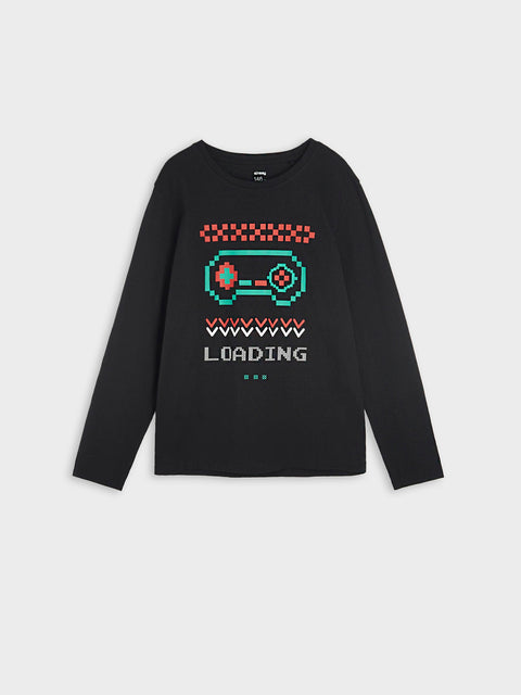 Black sweater with pixelated game controller design on a white background