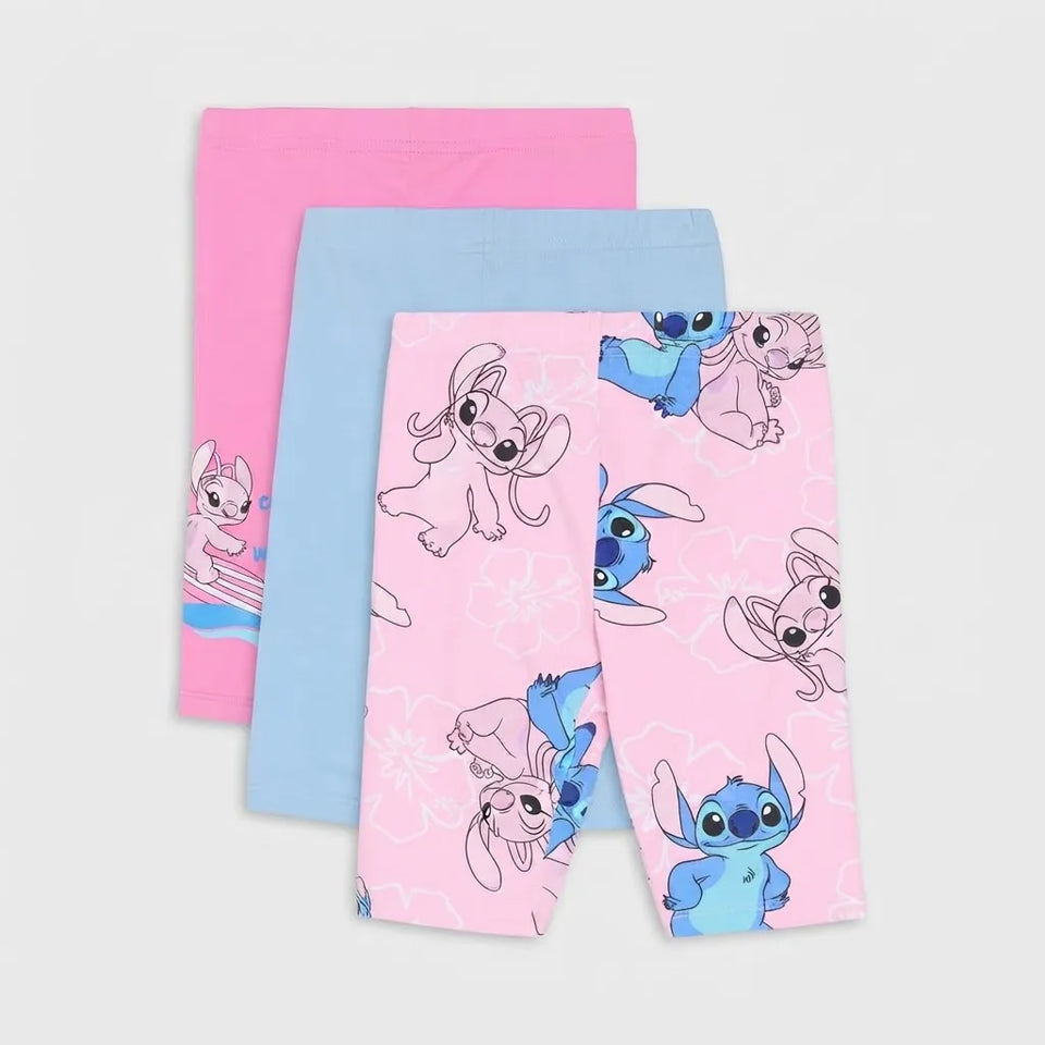 Three pairs of children's leggings or tights stacked on a light gray background: one pink pair with a cartoon bunny print, one light blue pair, and one pink pair with a blue cartoon character print.