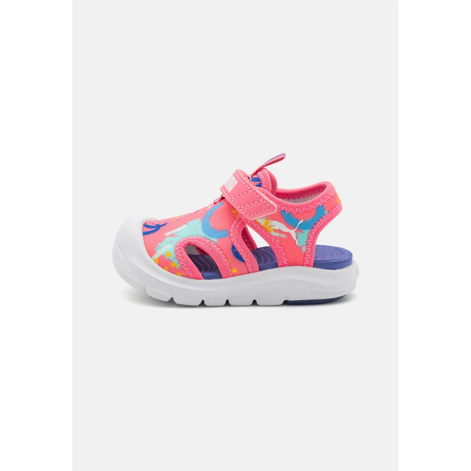 A single children's sandal in bright pink with multicolor cartoon-style graphics, a hook-and-loop strap closure, and a thick white sole, shown against a light gray background.