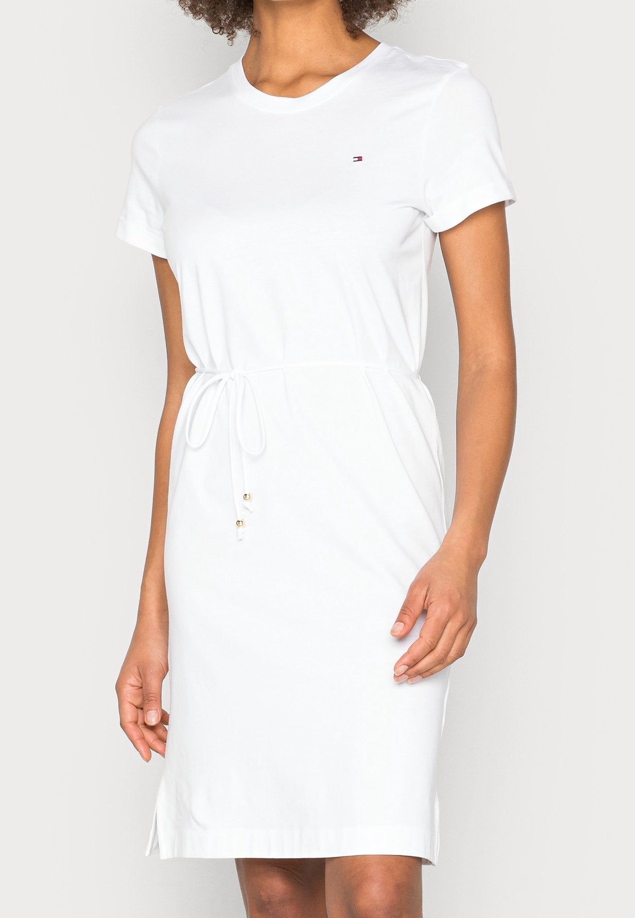 White dress worn by a person on a white background