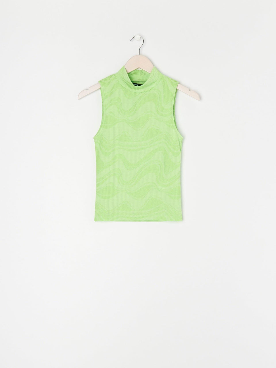 Green sleeveless top on a hanger against a white background