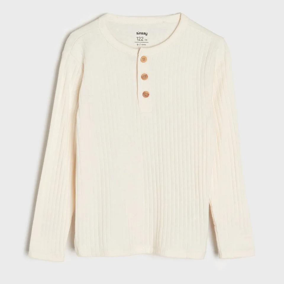 An off-white ribbed long-sleeve henley shirt with three brown buttons, shown flat against a light gray background.