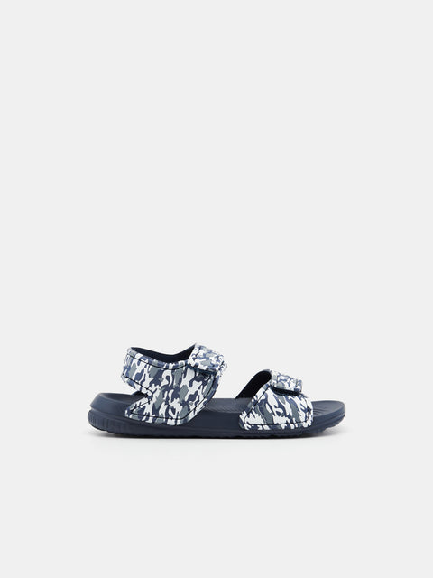 Pair of sandals with camouflage straps on a white background