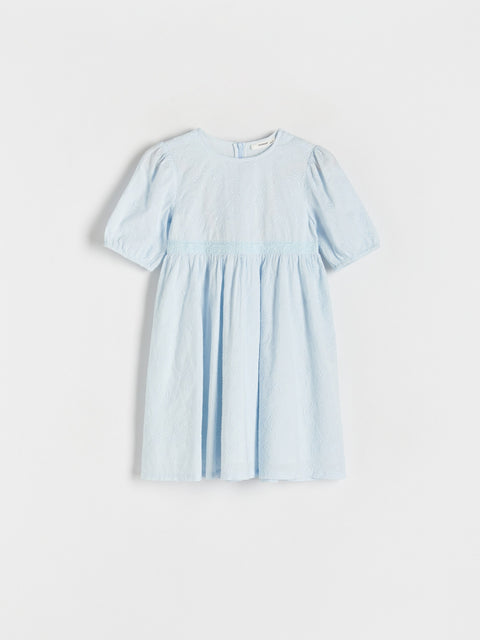 Light blue dress with short sleeves on a white background