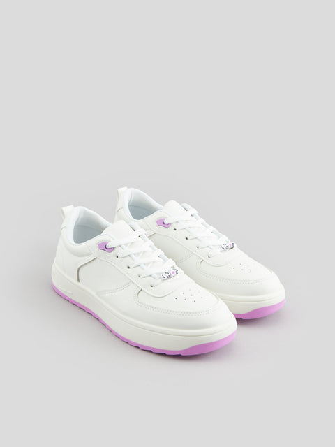 White sneakers with purple accents on a light gray background