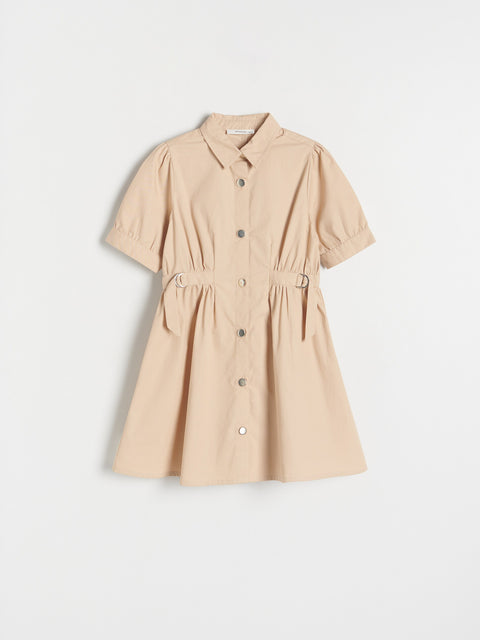 Beige dress with short sleeves on a light gray background