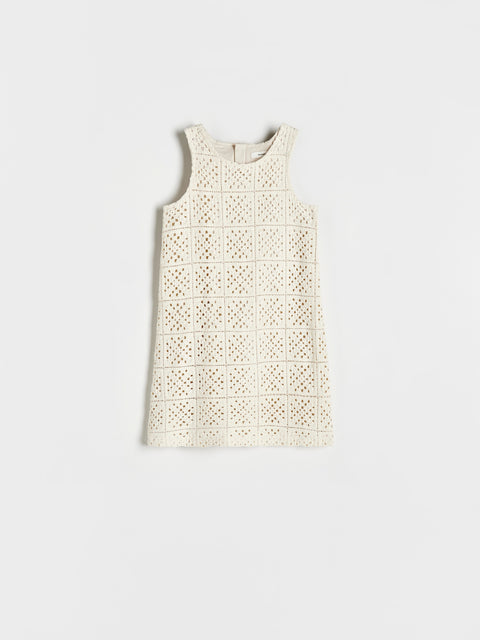 White lace dress on a light gray background