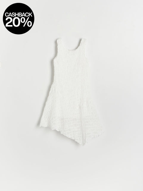 White sleeveless top on a light gray background