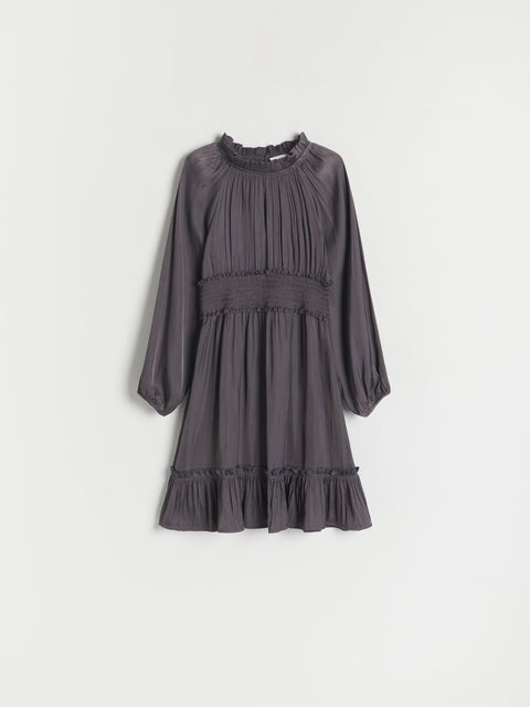 Dark gray dress with long sleeves on a light gray background