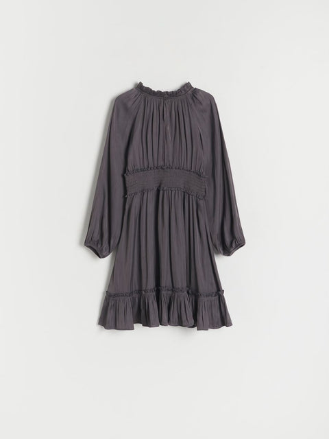 Gray dress with long sleeves on a light gray background