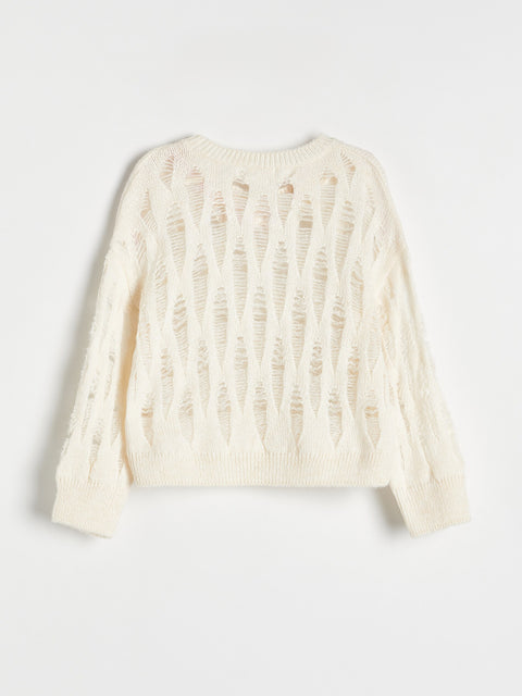 Cream-colored knit cardigan on a light gray background