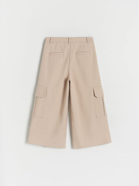 Beige cargo pants on a light gray background