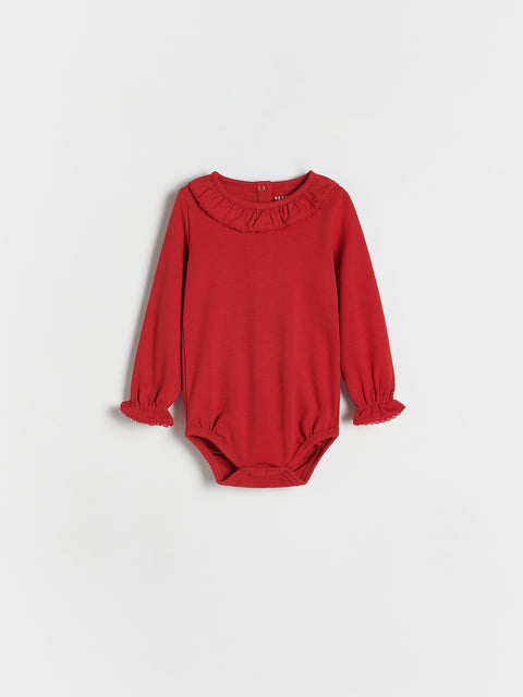 Red baby bodysuit with ruffled neckline on a white background